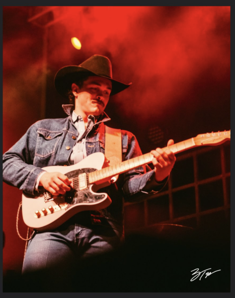 During a performance, Zach Top plays his guitar for the audience. Photo courtesy of Zach Top Official.
